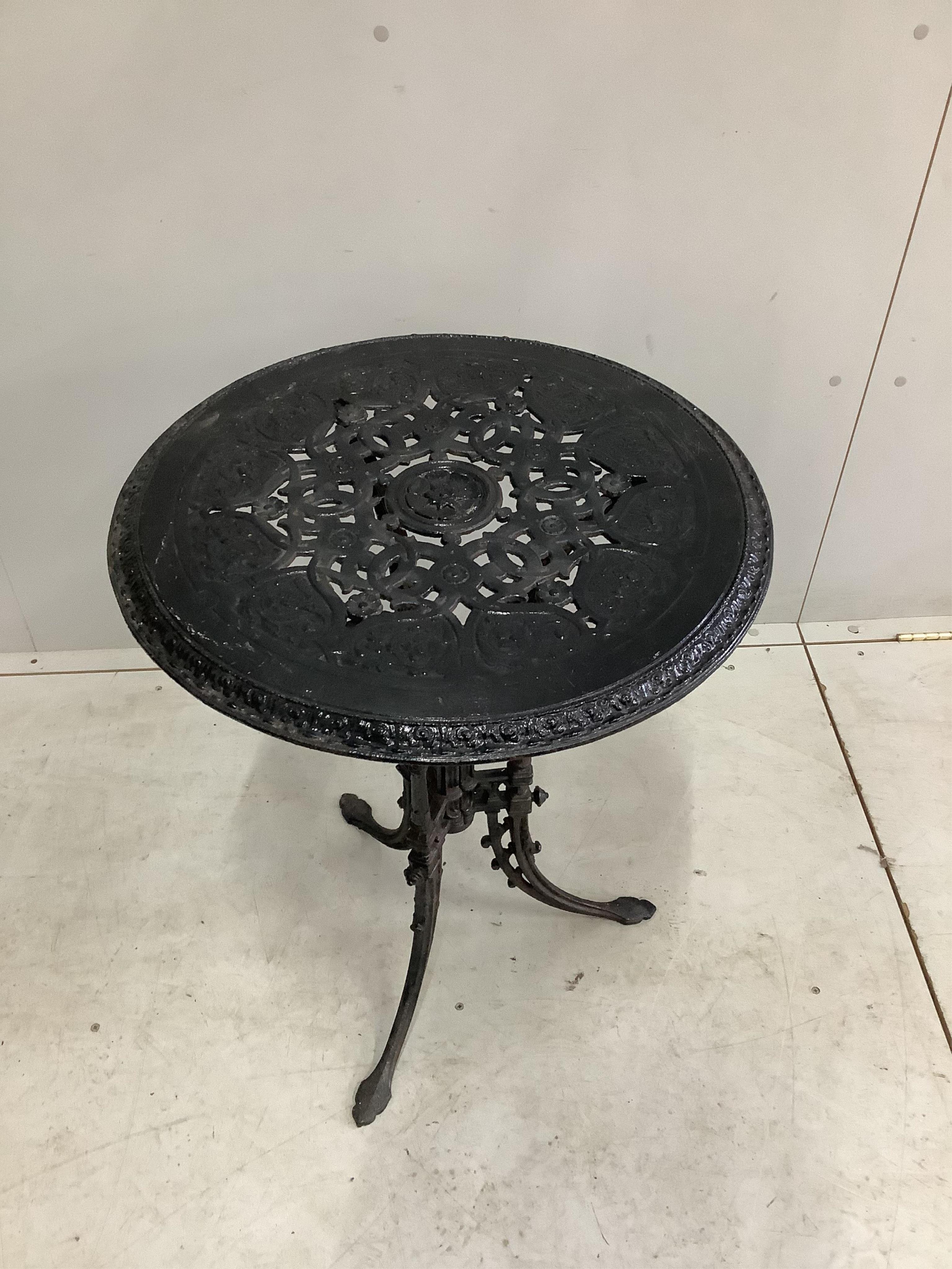 A Victorian black painted cast iron garden table, diameter 55cm, height 72cm. Condition - fair to good